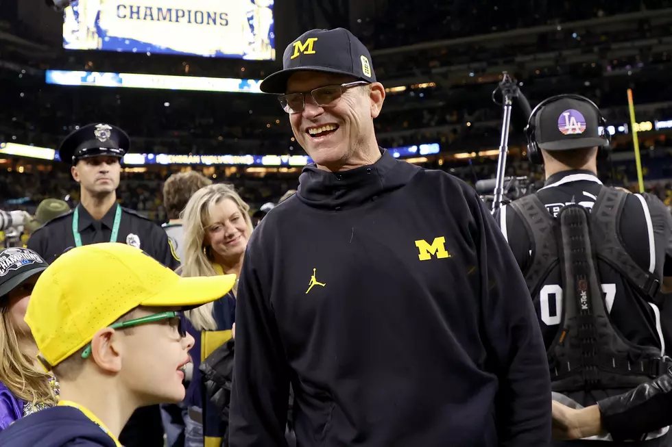 Did U of M Coach Harbaugh Tell Team He'd "Help Raise Their Baby"?