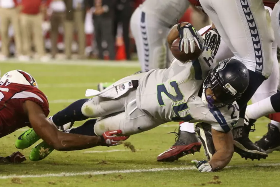 Wilson And Lynch Lead Seattle Past Arizona 34-22