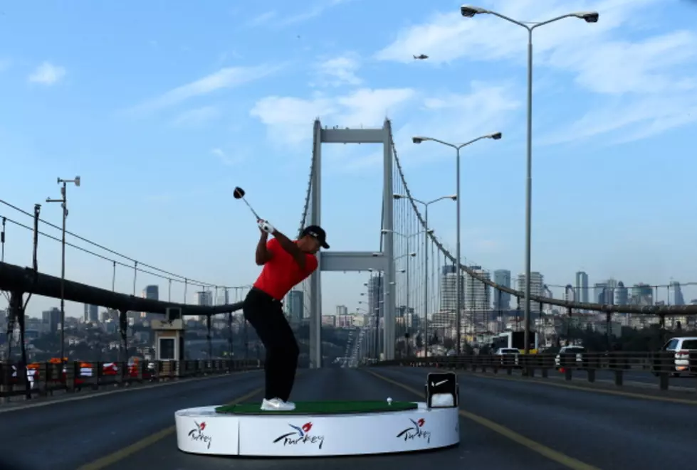 Tiger Woods Hits Golf Balls From Europe To Asia