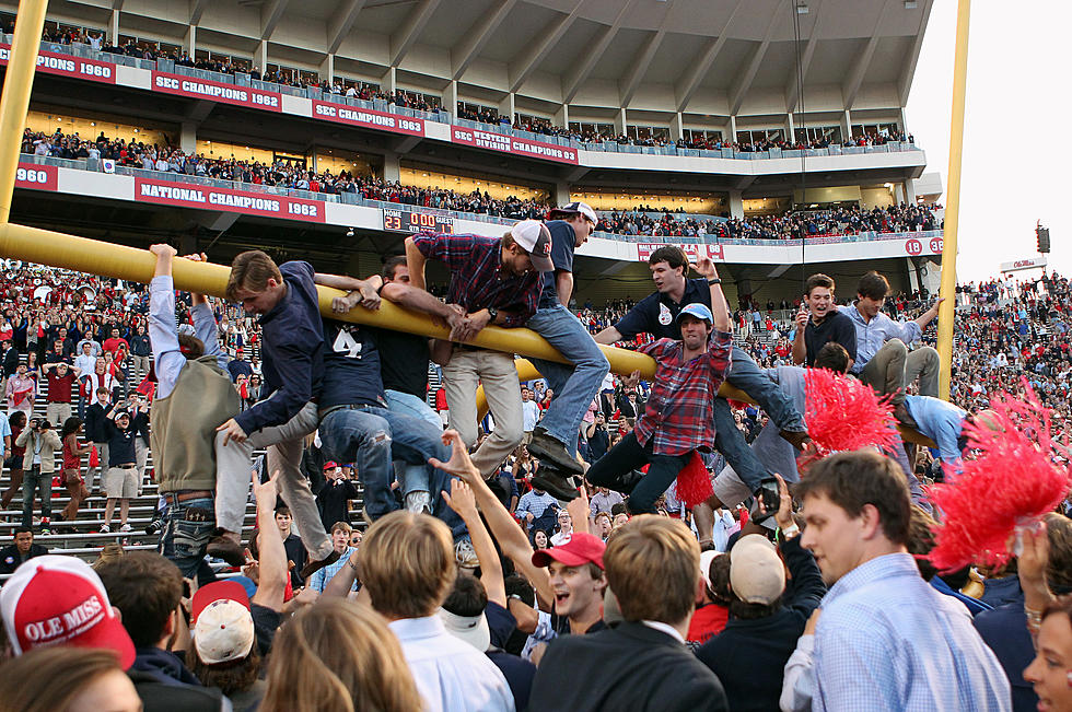 Ole Miss Fans Bring Down the Goal Posts, Carry Them to the Grove, Then the Square