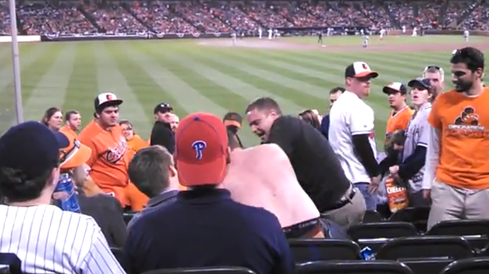 Crazy Yankees Fan Laughs While Getting Punched in the Face 