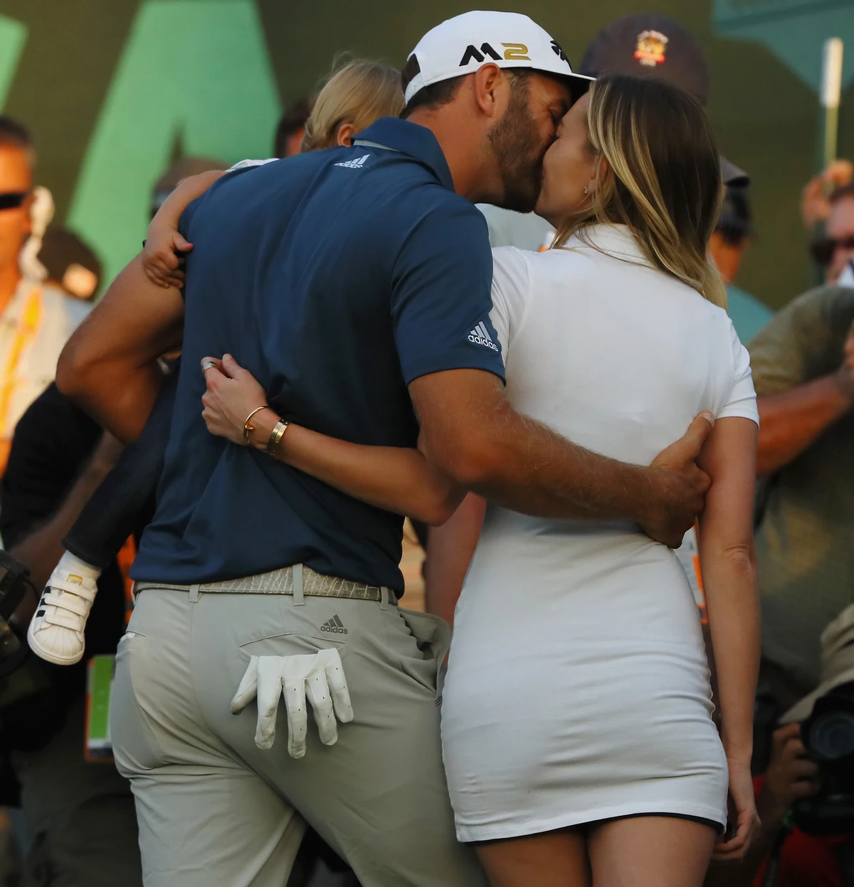 ...it was his fiance Paulina Gretzky and her short white dress that made he...