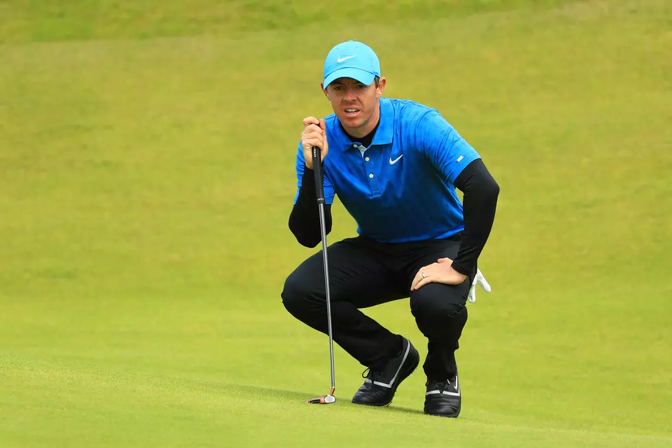 The Latest: McIlroy Shoots 79 After Wild Opening Round