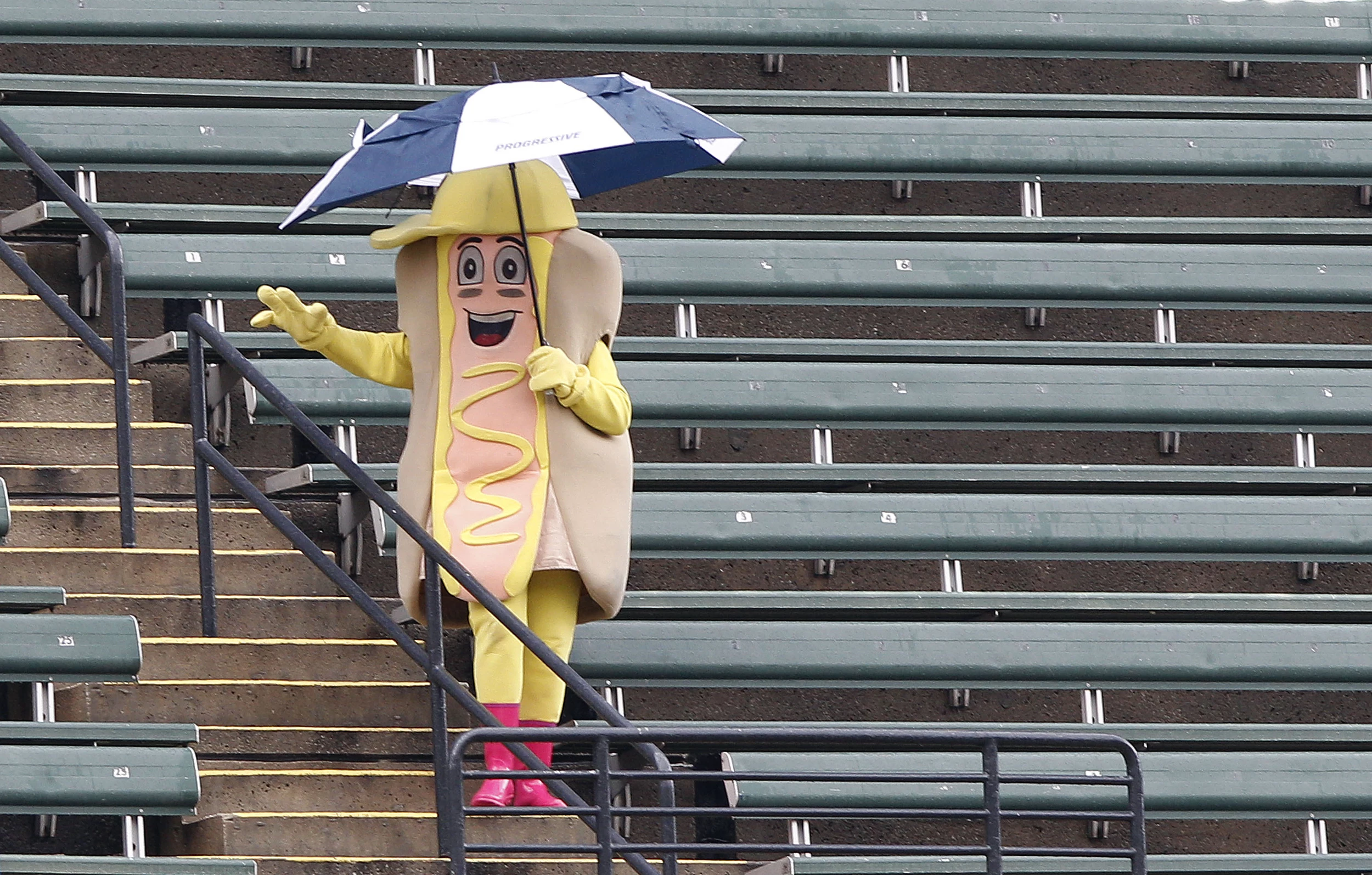 Chicago White Sox mascot Southpaw, dressed as a bottle of mustard, carries  a bottle of mustard around before a baseball game against the Cleveland  Guardians, Thursday, May 18, 2023, in Chicago. (AP