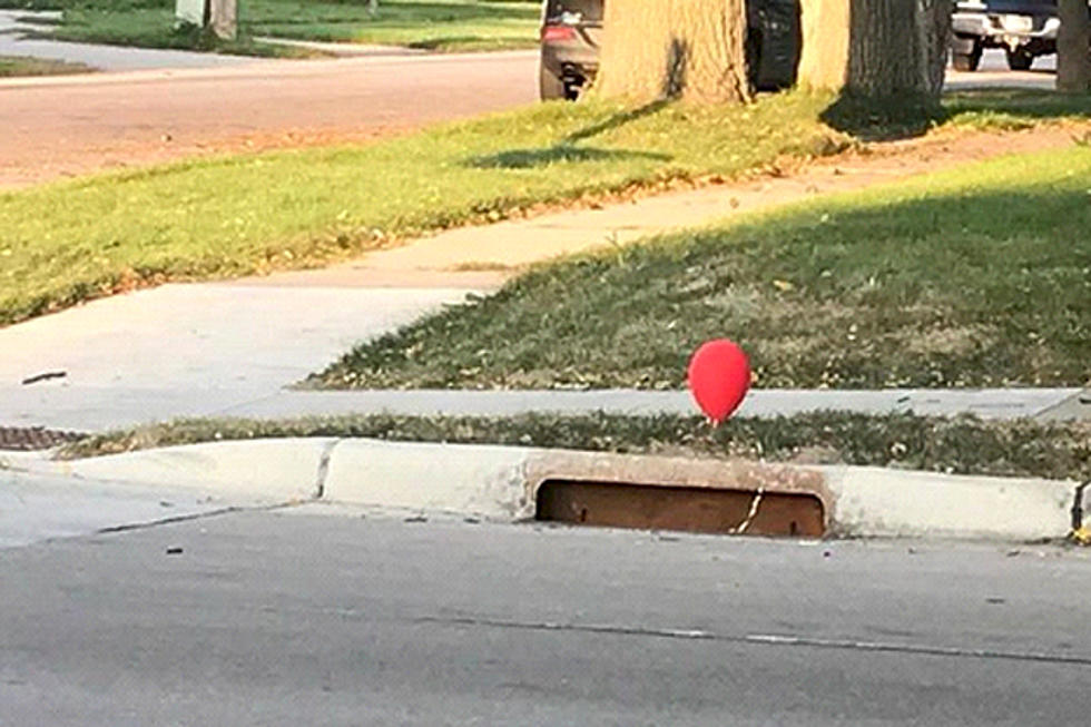 These Red Balloons Tied to a Sewer Grate Have a Creepy Meaning
