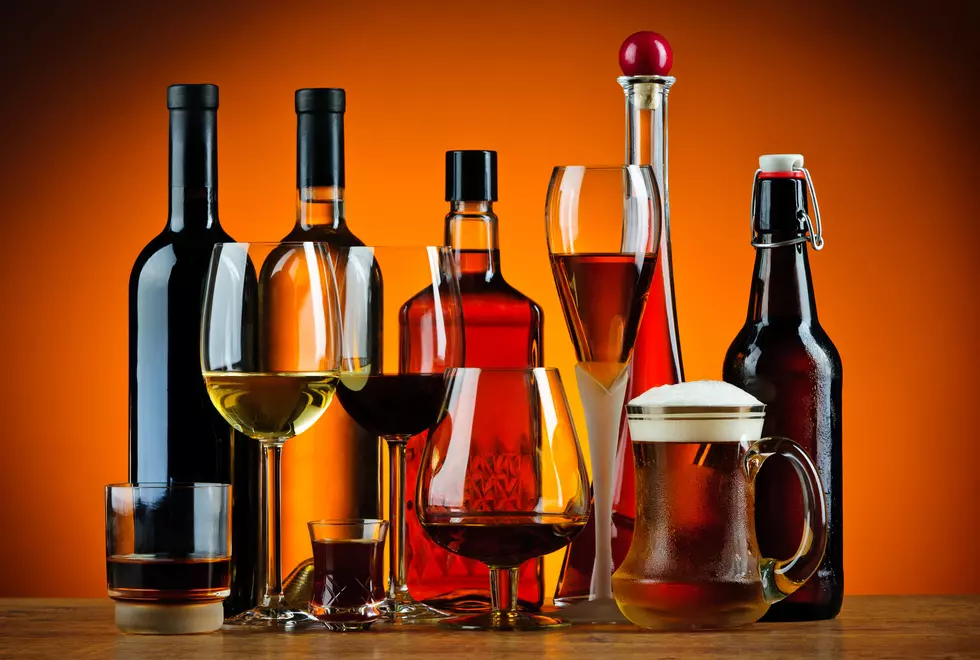 still life with various glasses and bottles of alcohol
