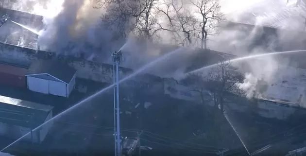 Large Warehouse Fire Sends Plumes of Smoke into the Air Around Camden, NJ