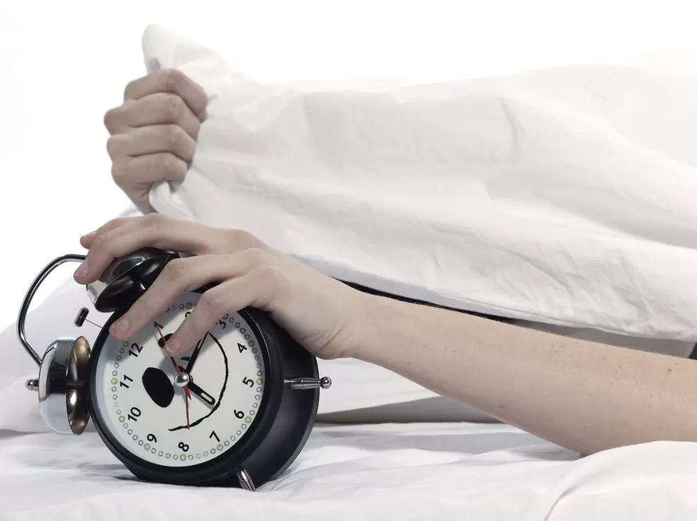 woman in bed awakening