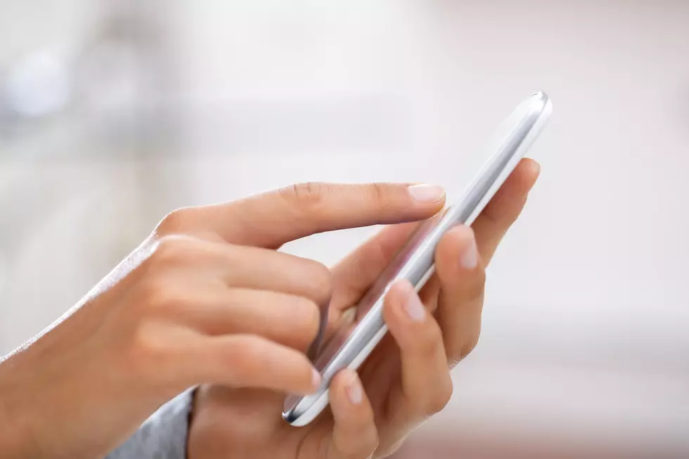 Close up of hands woman using cell phone.