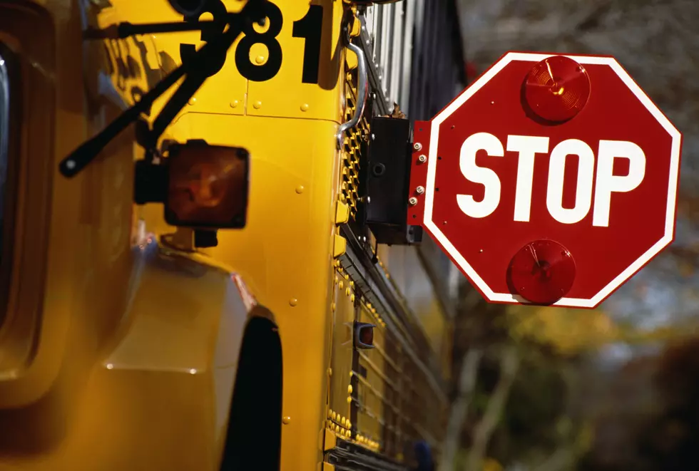 Officials: 1 hospitalized after school bus runs stop sign