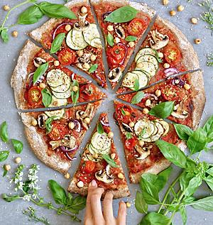 Healthy Vegan Pizza Topped with Zucchini and Fresh Vegetables