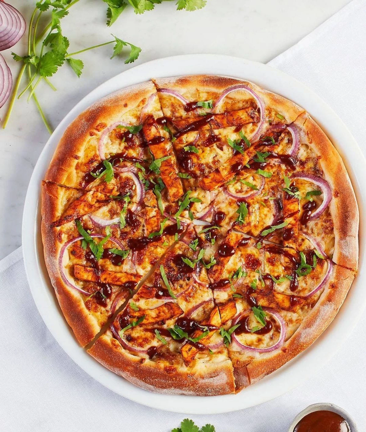 California Pizza Kitchen Adds Plant-Based BBQ Chicken to ...
