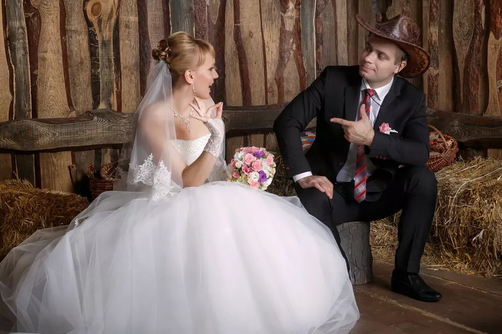 Portrait of the bride and groom in a cowboy hat