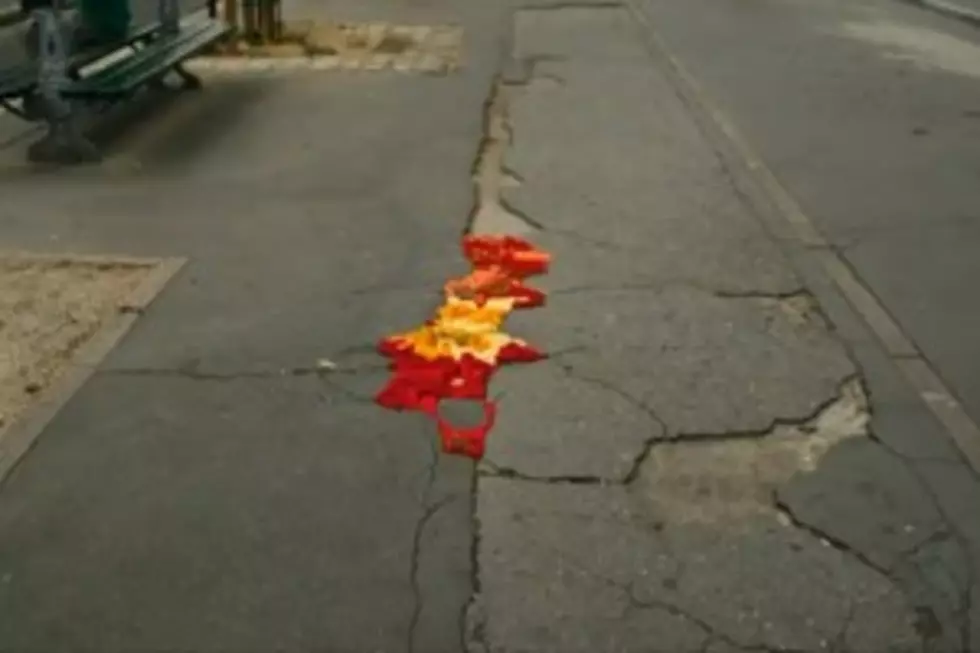Artist Covers Potholes in Paris With Knitwork