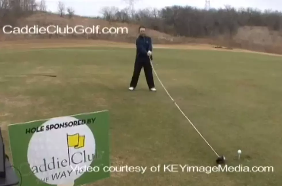 Watch A Guy Hit A Golf Ball With A 14 Foot Driver [VIDEO]