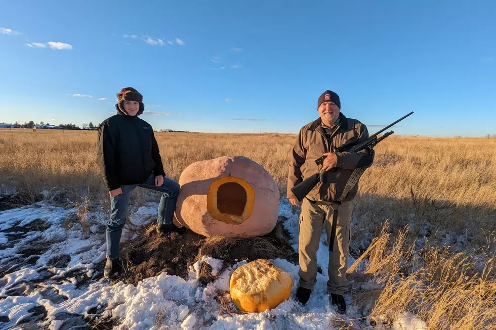 Blanca the Pumpkin, framed by Dan Moss (right) and Jacob Moss (left)