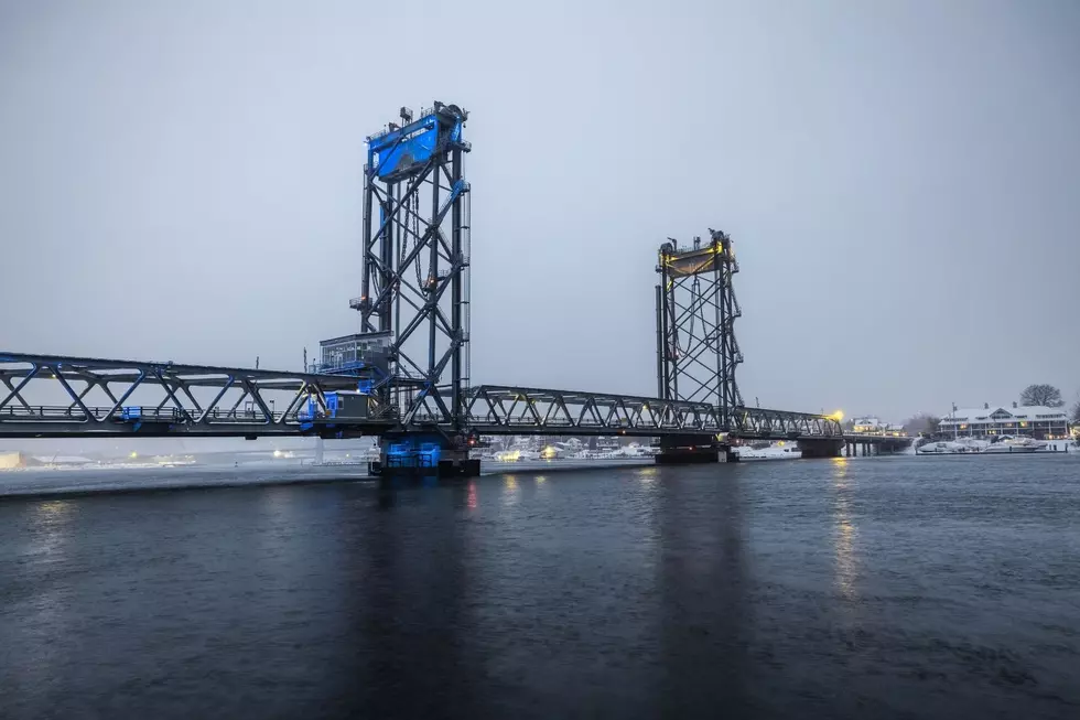 Memorial Bridge between Portsmouth and Kittery lit in the colors of the Ukranian flag before nightfall