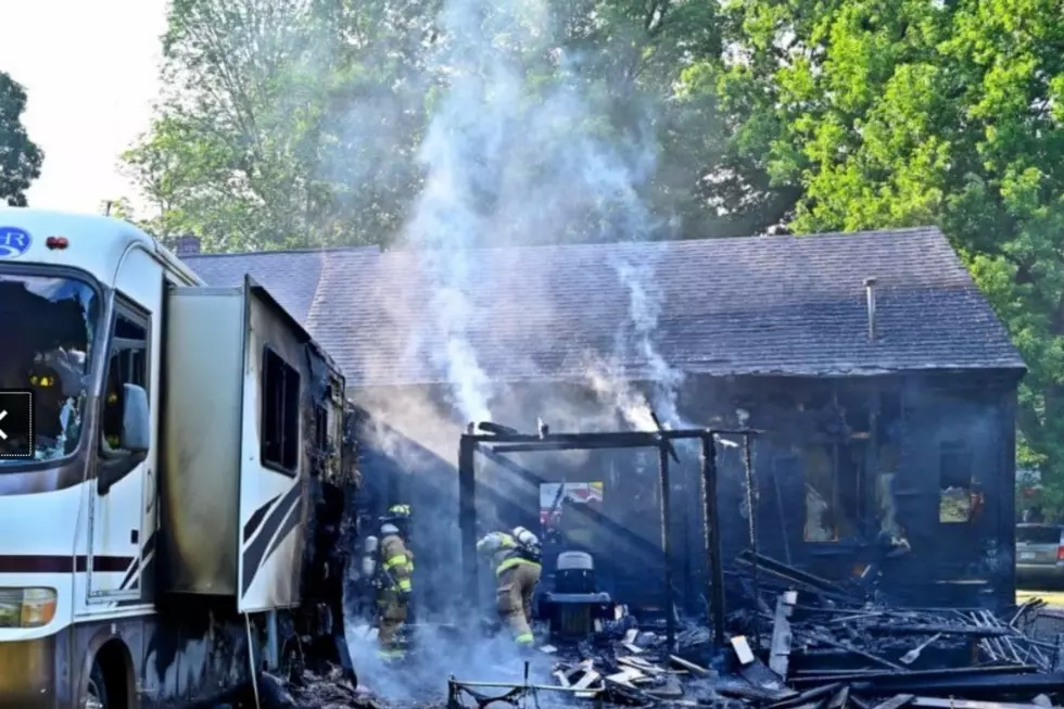 Fire damaged RV and house at a home in East Kingston 7/11/22